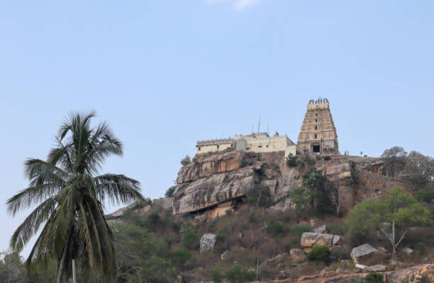Melkote town is famous for the beautiful Hindu temple landscapes, here is a view of Yoga Narasimha temple atop a hillock against the blue sky in Karnataka,India.